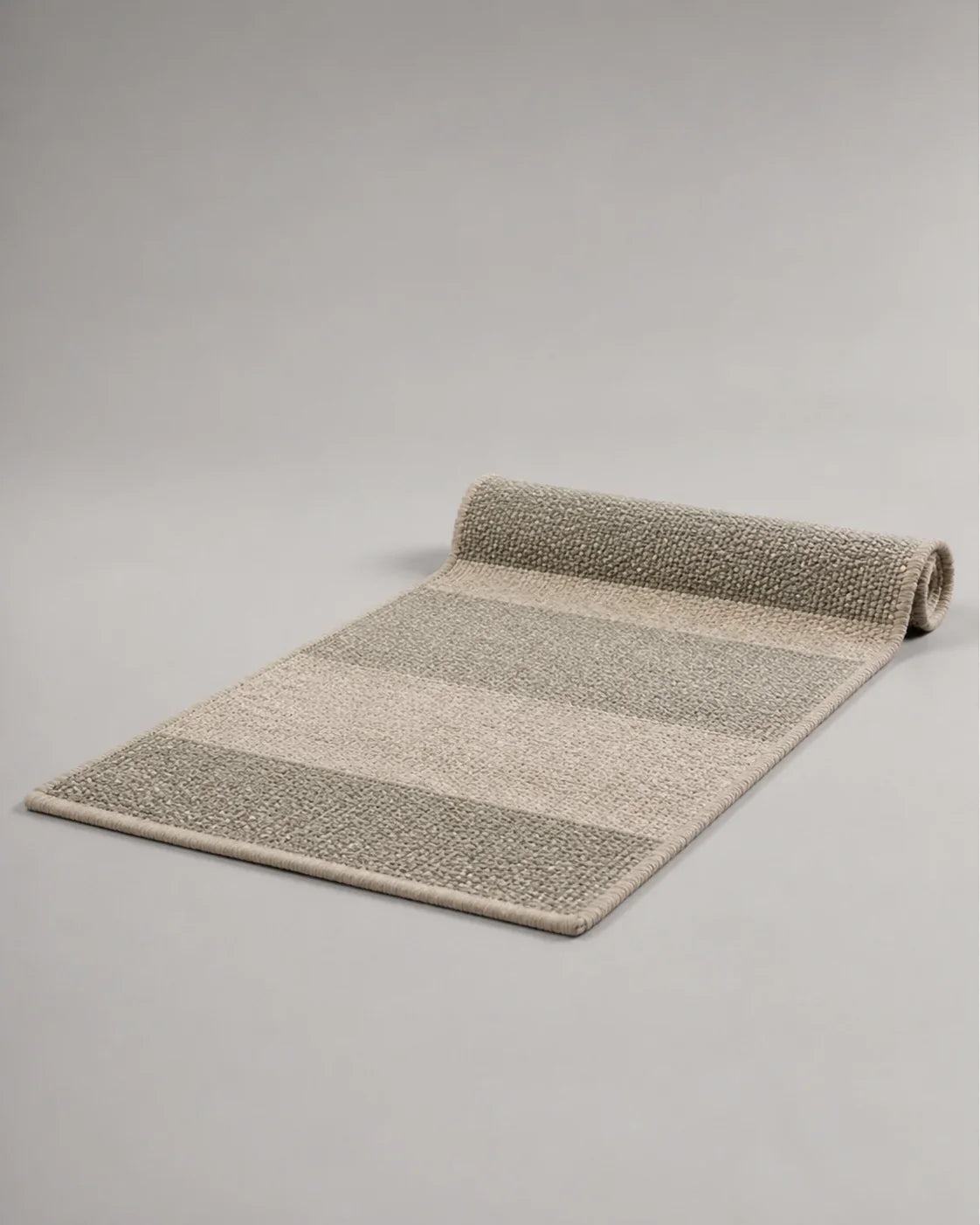 Alcove Handwoven Wool Floor Mat by ALPORA, a long flatwoven wool mat designed for bedside, reading corner or quiet threshold