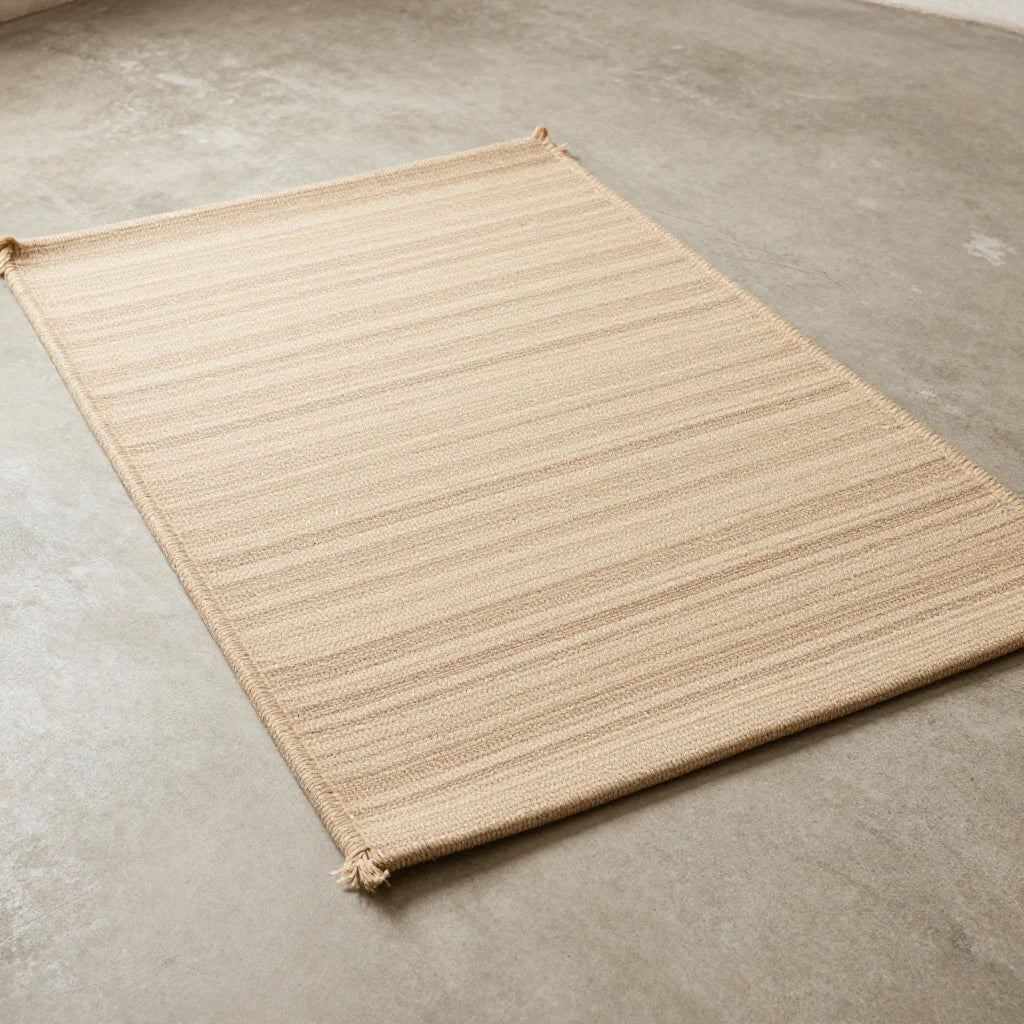 Pulu Floor Mat by ALPORA, a thick pulu floor mat in natural undyed wool, the traditional tibetan ground covering used from monastery halls to nomad tents